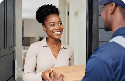 Customer receiving a delivery package at her door